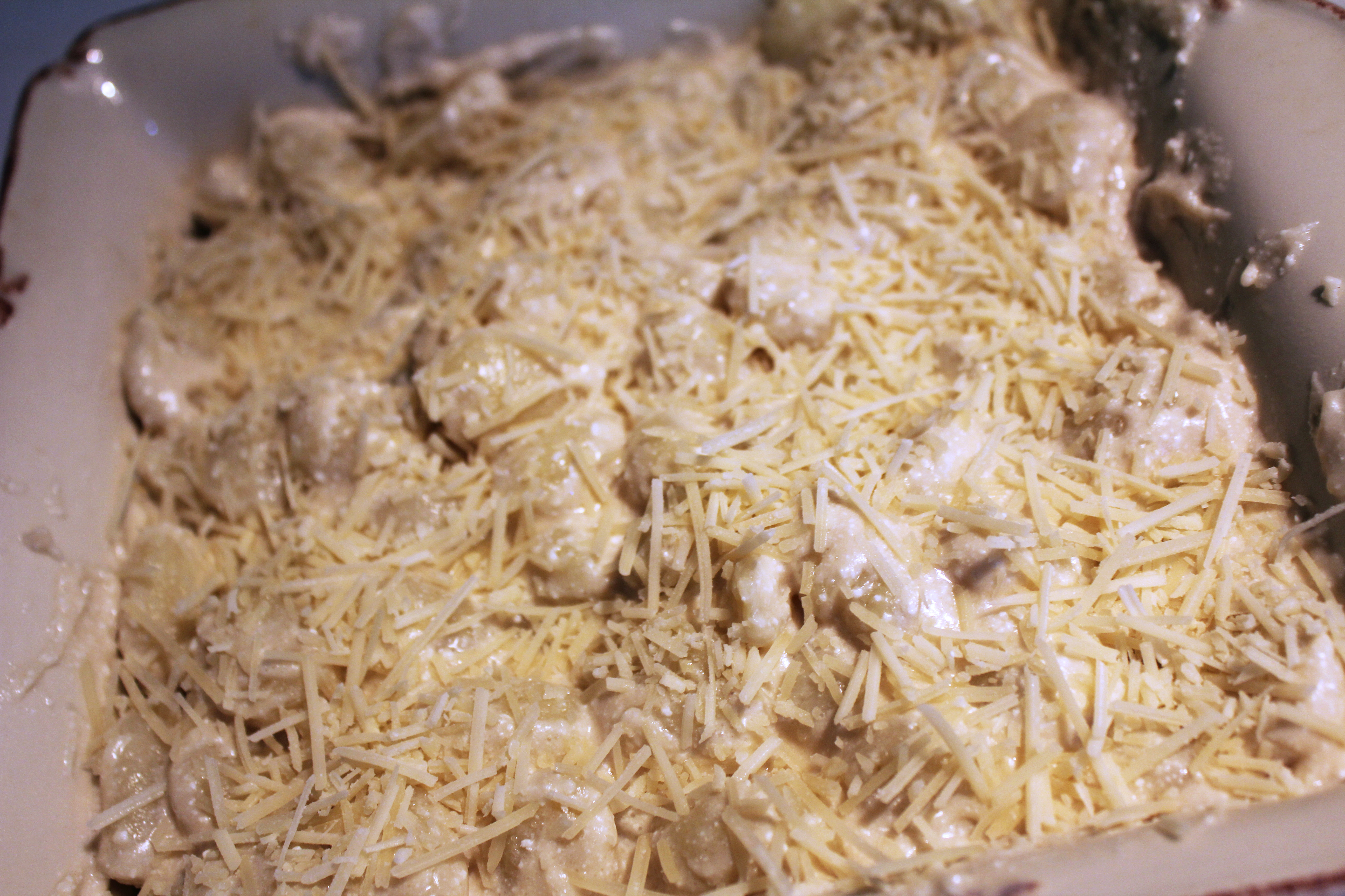 gnocchi with cheese on top