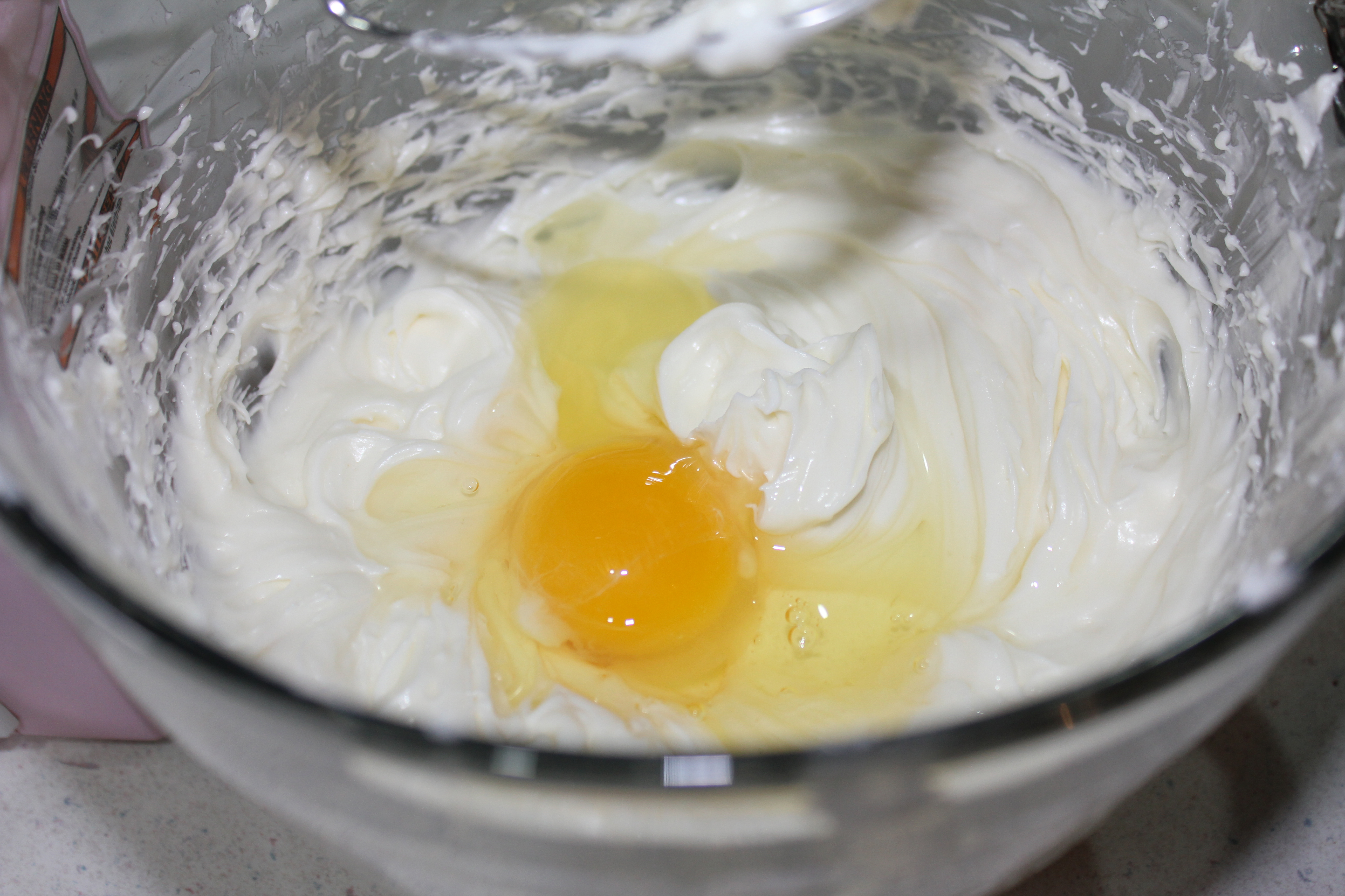 Add eggs, one at a time.