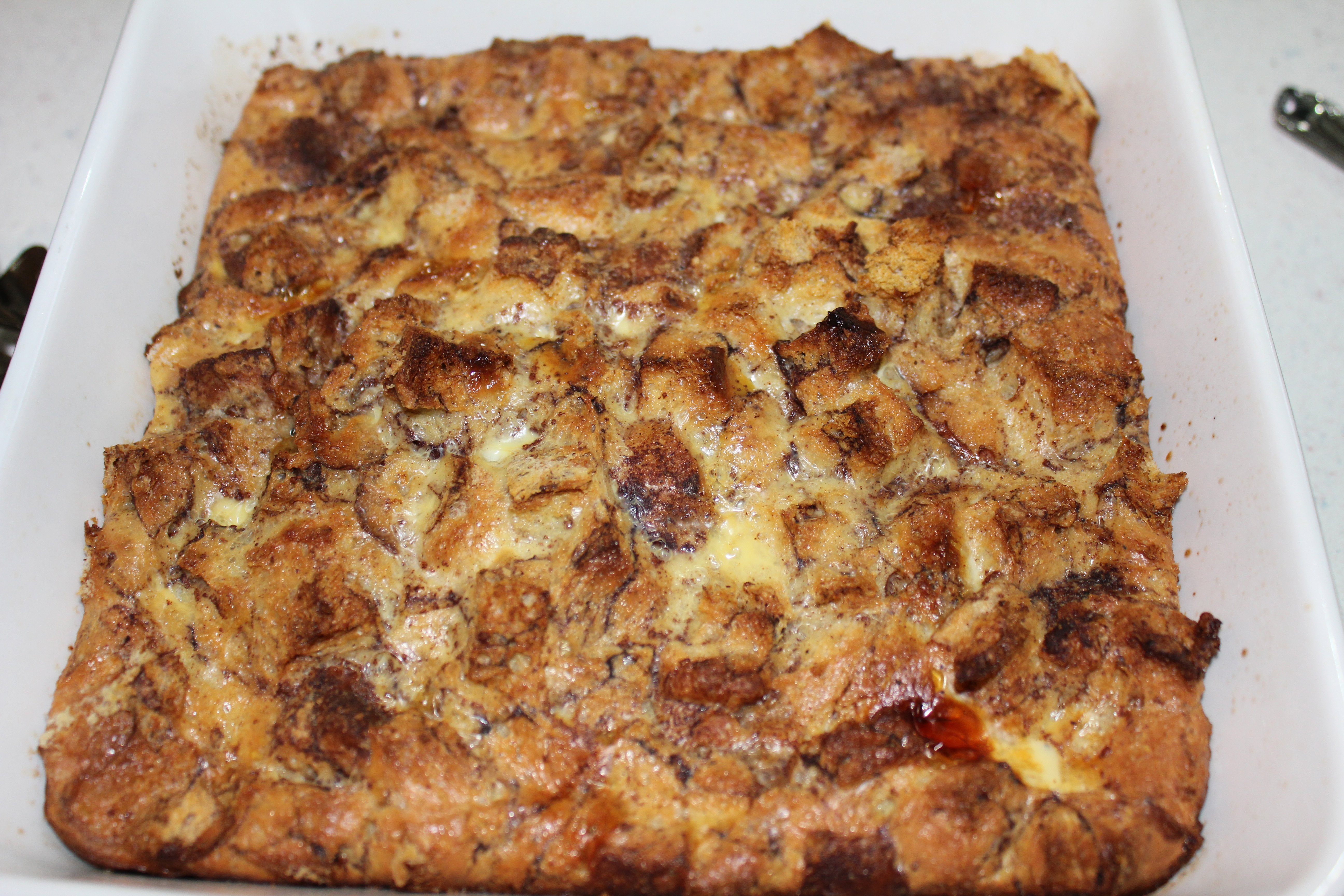 Cut baked bread pudding into slices and serve with warm syrup. It will make your knees wobbly and your stomach very happy.