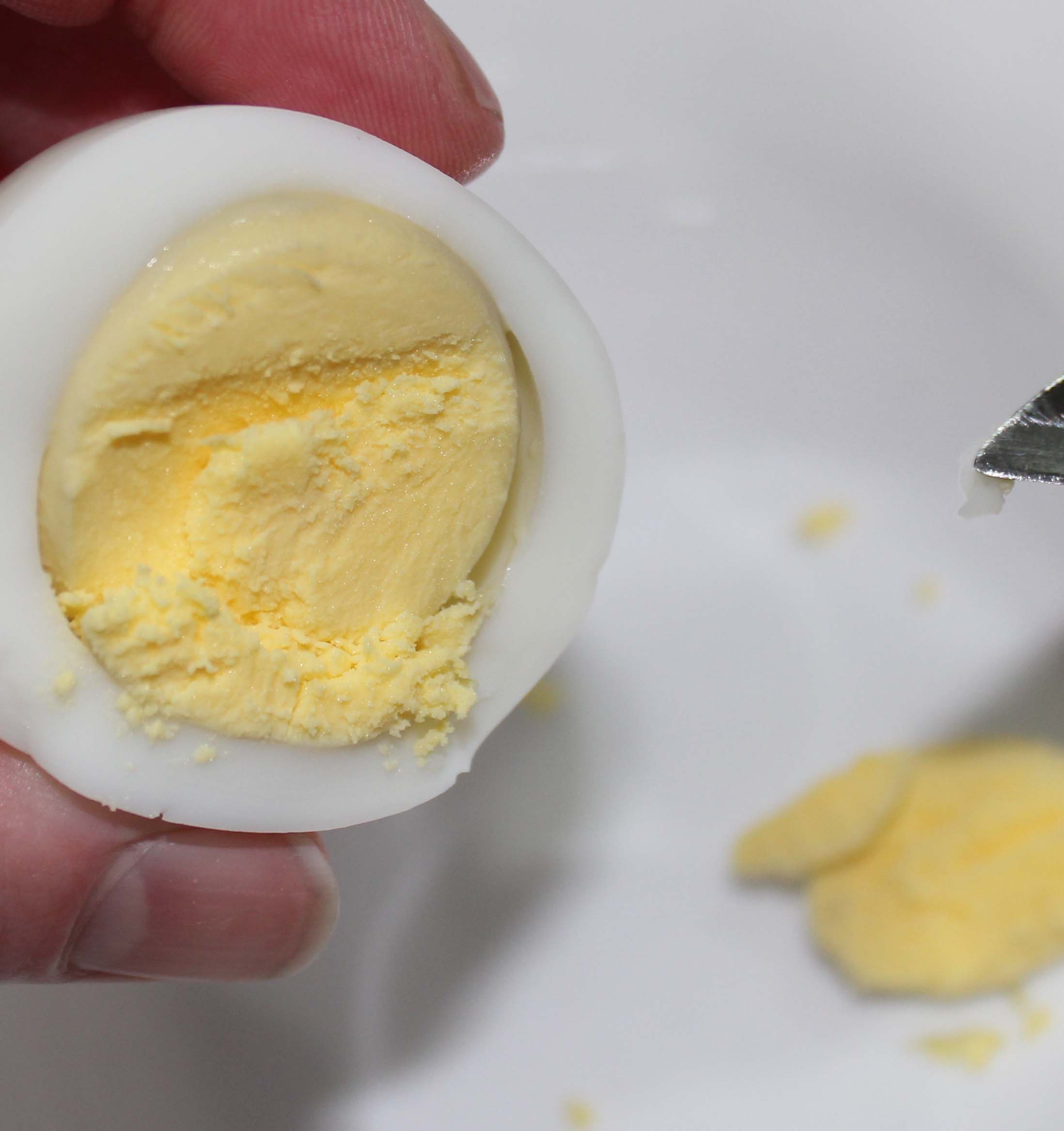 Once the eggs are cooked and cooled, remove yolks.