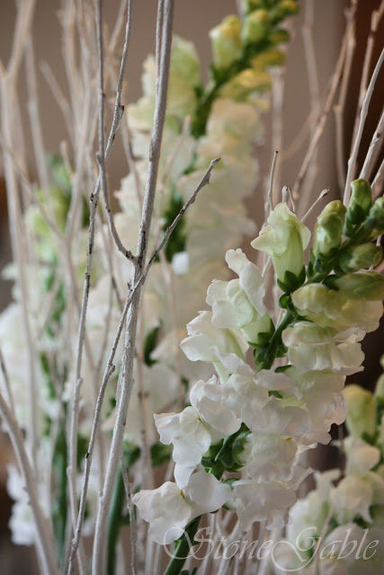 Love the white snapdragons with the white twigs from Stone Garden.