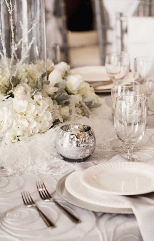 This design from DigsDigs is beautiful. The white on white tones are awesome, especially with the silver accents.