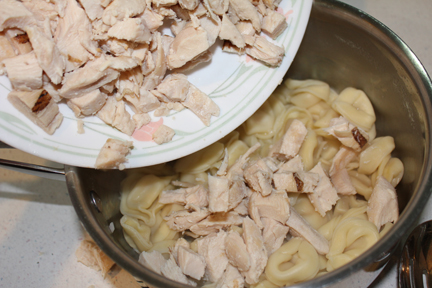 When tortellini is cooked, drain. Since I'm lazy, I mixed everything in the saucepan so I had one less bowl to wash.